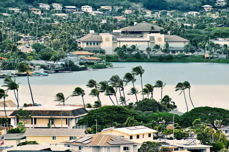 Hawaiʻi Kai marina with palm trees, waterfront homes, and hillside residences