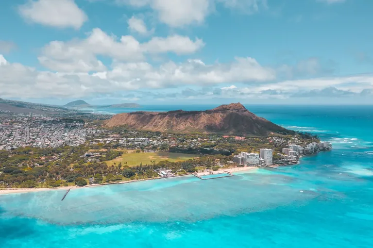 Aerial view of Diamond Head, the Honolulu shoreline, and surrounding neighborhoods